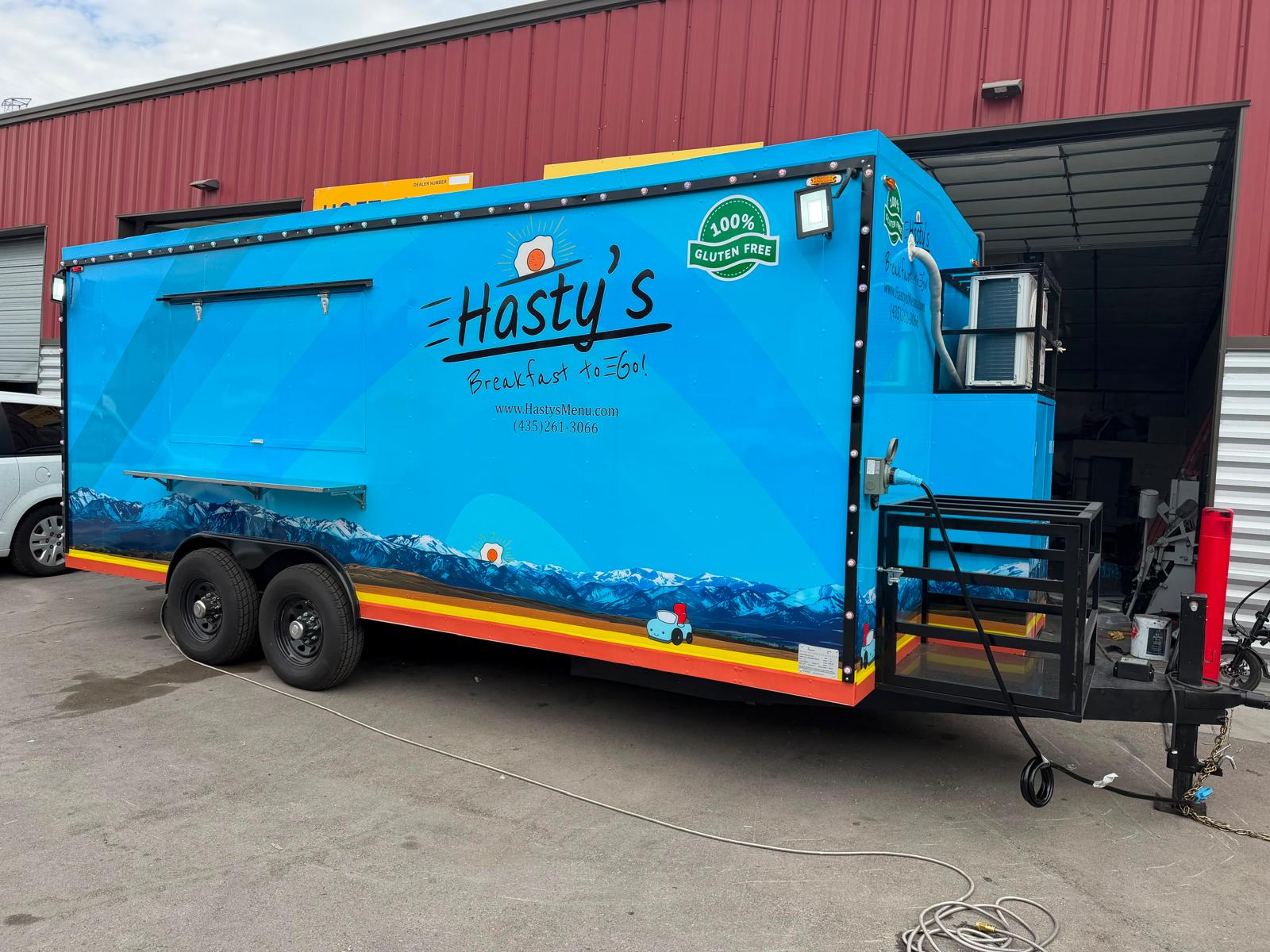 Blue custom food trailer built by UCF Trailers USA